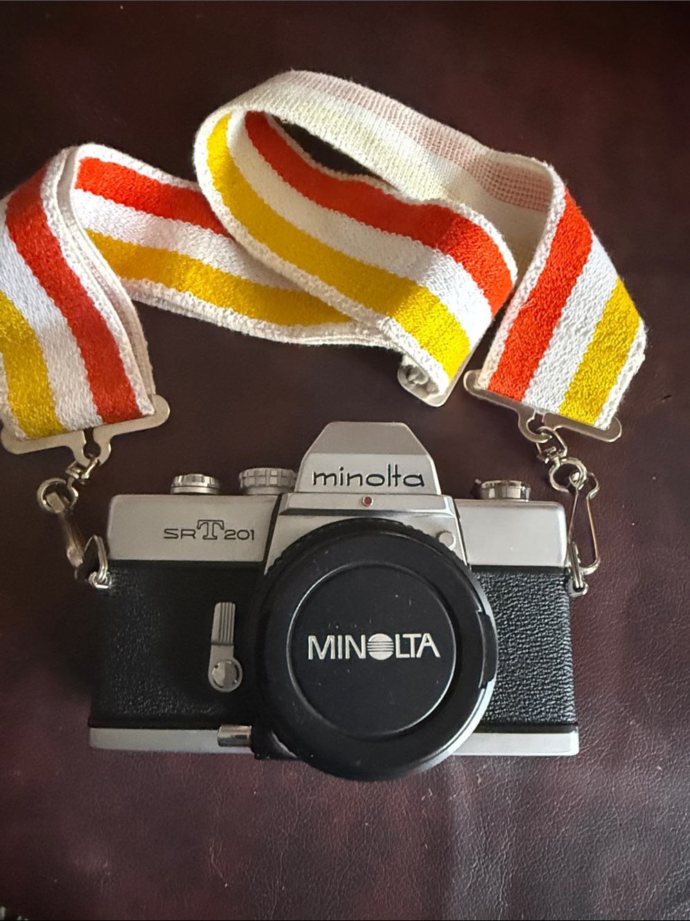 Minolta SR-T 201 35mm Film Camera in Silver and Black with Retro Stripe Strap